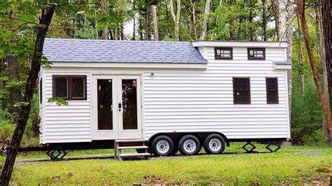 Designers used neutral colors, blond wood, and minimalistic style . . Used tiny house on wheels for sale